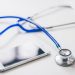 Photo of stethoscope and mobile for online doctor consultation
